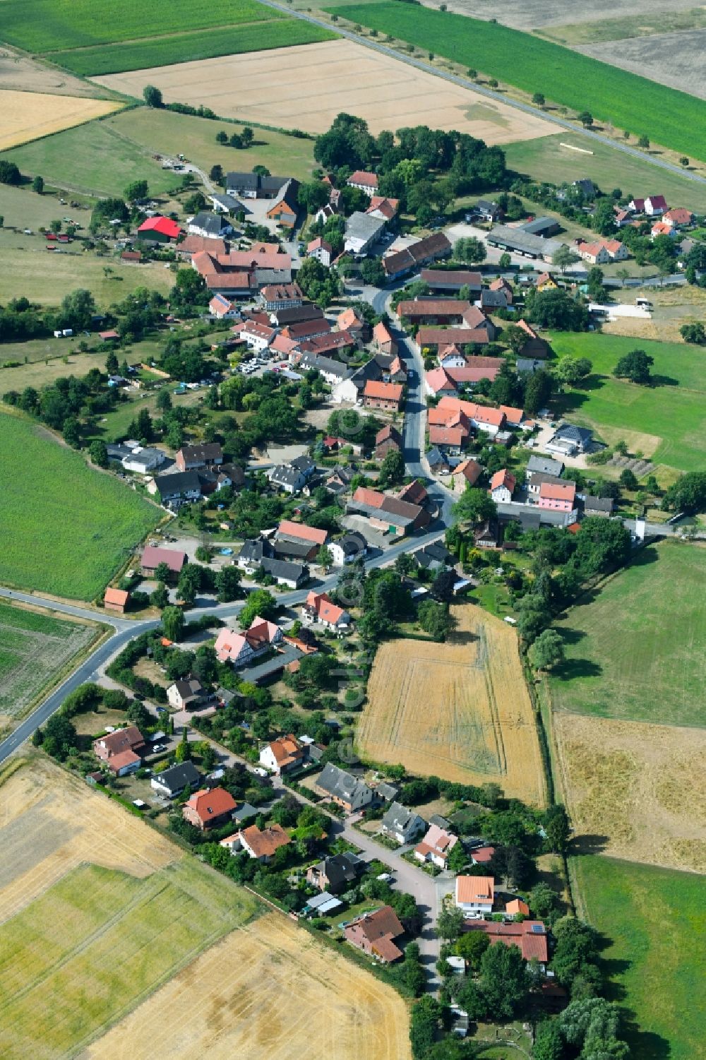 Aerial image Scheppau - Village - view on the edge of agricultural fields and farmland in Scheppau in the state Lower Saxony, Germany