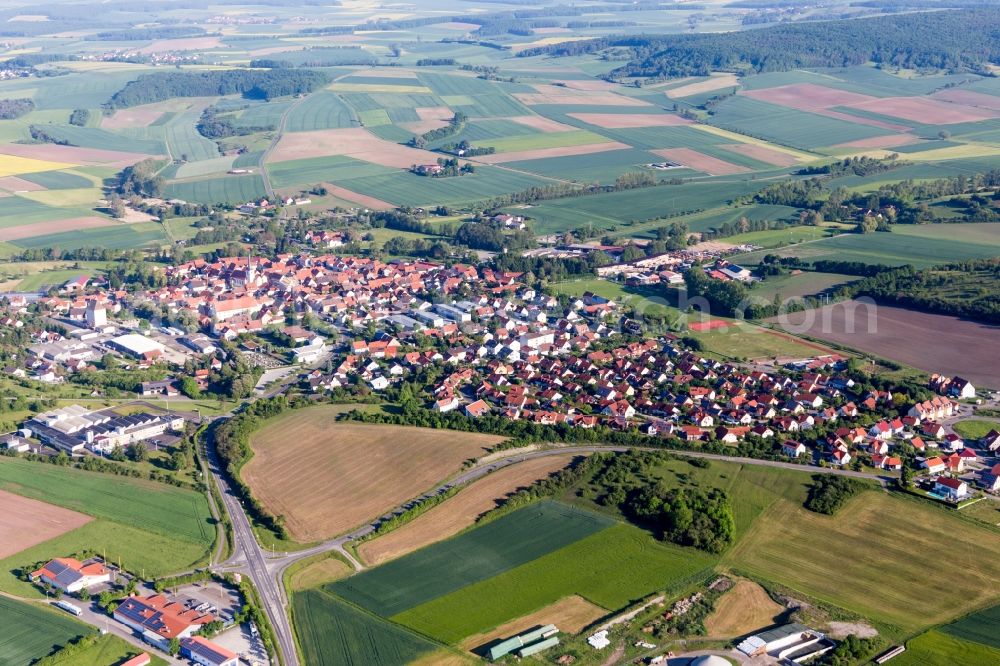 Stadtlauringen from the bird's eye view: Village - view on the edge of agricultural fields and farmland in Stadtlauringen in the state Bavaria, Germany