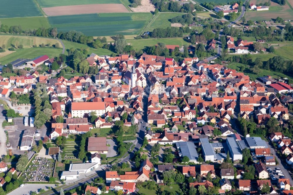 Aerial image Stadtlauringen - Village - view on the edge of agricultural fields and farmland in Stadtlauringen in the state Bavaria, Germany