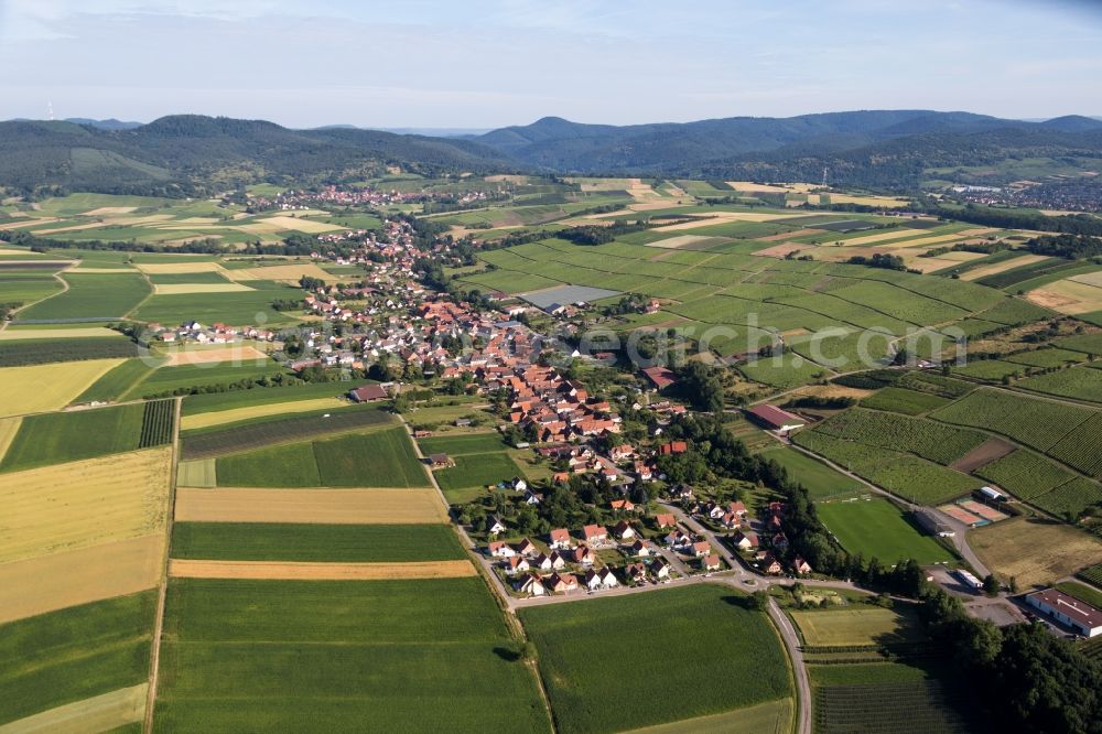Aerial image Steinseltz - Village - view on the edge of agricultural fields and farmland in Steinseltz in Grand Est, France