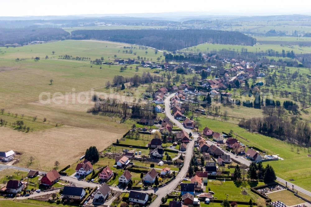 Struth from the bird's eye view: Village - view on the edge of agricultural fields and farmland in Struth in Grand Est, France