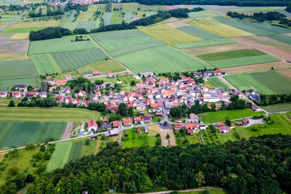 Theinfeld from the bird's eye view: Village - view on the edge of agricultural fields and farmland in Theinfeld in the state Bavaria, Germany