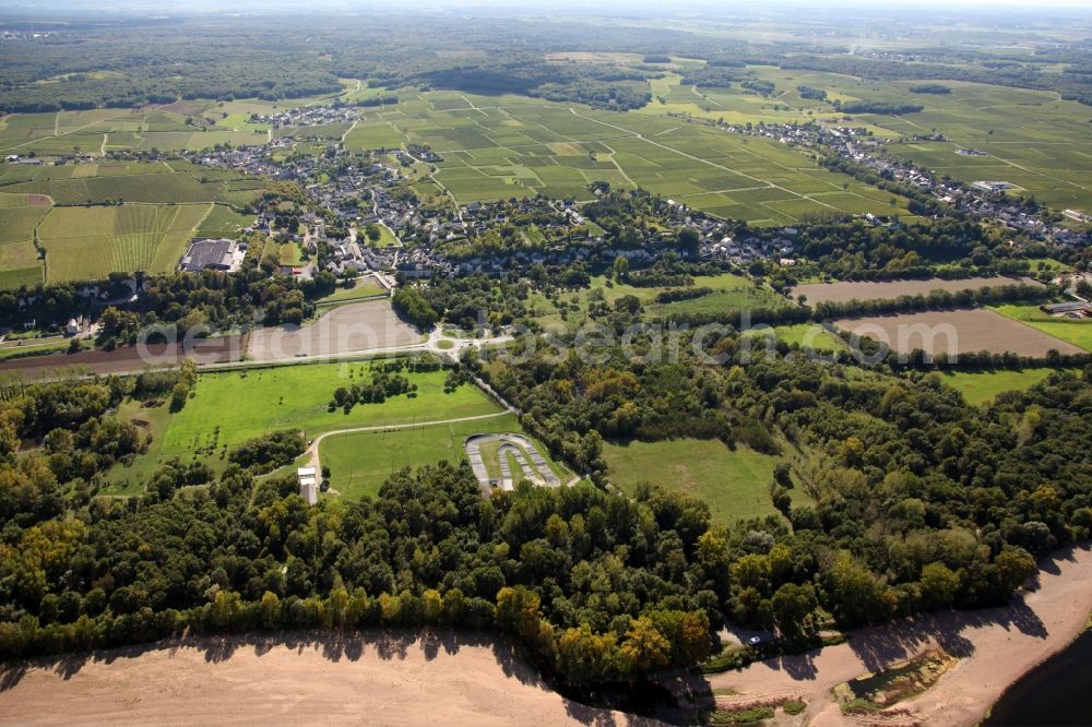 Turquant from the bird's eye view: Village - view on the edge of agricultural fields, vineyards and farmland in Turquant in Pays de la Loire, France