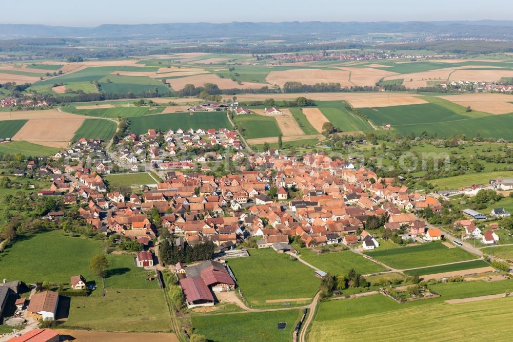 Uhrwiller from the bird's eye view: Village - view on the edge of agricultural fields and farmland in Uhrwiller in Grand Est, France