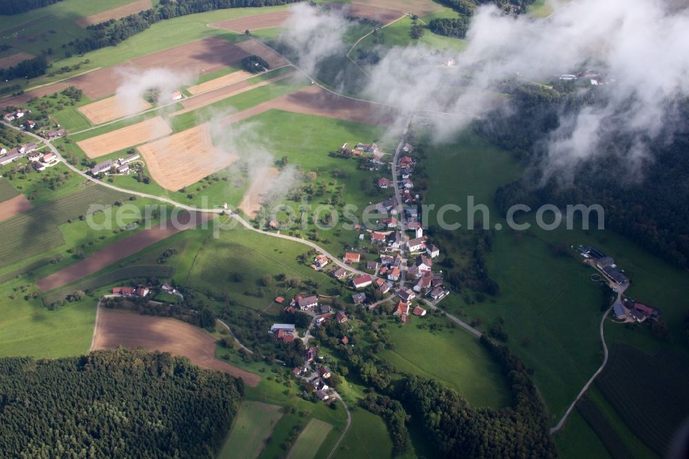 Eigeltingen from above - Village - view on the edge of agricultural fields and farmland under clouds in the district Reute in Eigeltingen in the state Baden-Wuerttemberg