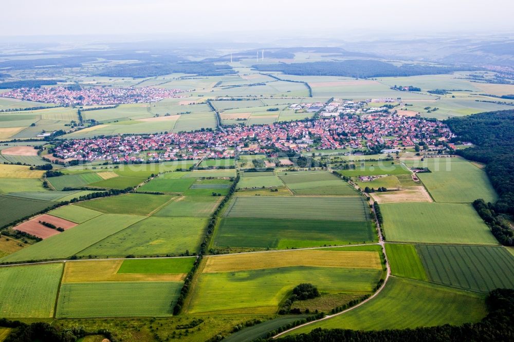 Aerial image Waldbüttelbrunn - Village - view on the edge of agricultural fields and farmland in Waldbuettelbrunn in the state Bavaria, Germany