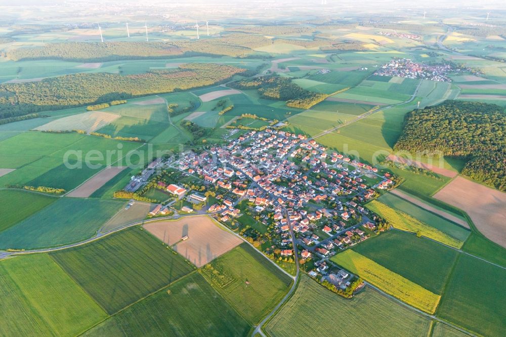 Wasserlosen from above - Village - view on the edge of agricultural fields and farmland in Wasserlosen in the state Bavaria, Germany