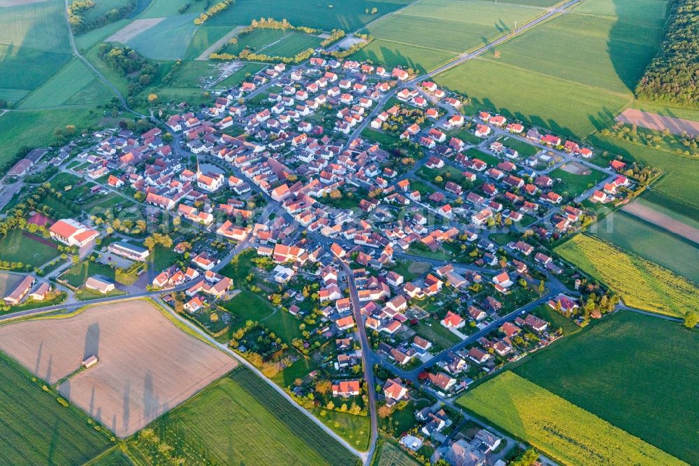 Wasserlosen from the bird's eye view: Village - view on the edge of agricultural fields and farmland in Wasserlosen in the state Bavaria, Germany