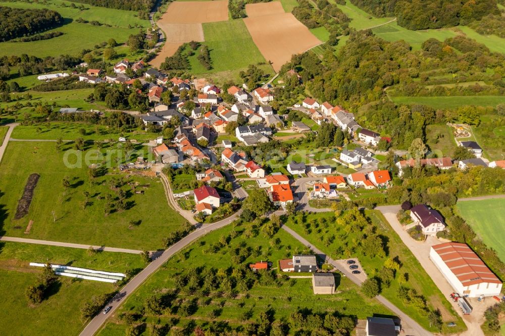 Wochern from above - Village - view on the edge of agricultural fields and farmland in Wochern in the state Saarland, Germany