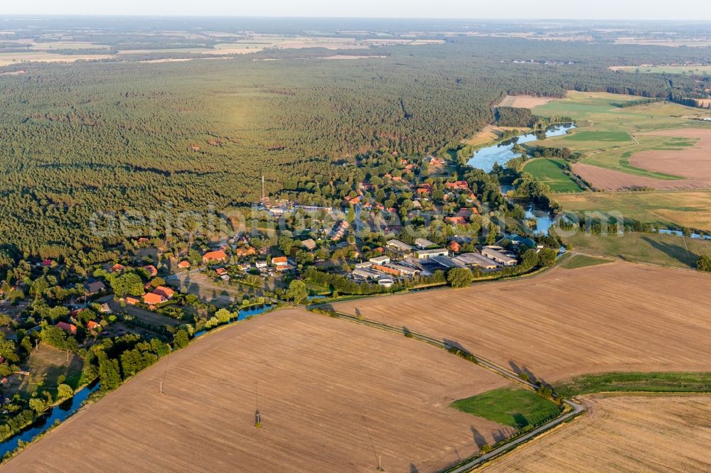 Zeetze from the bird's eye view: Village - view on the edge of agricultural fields and farmland in Zeetze in the state Lower Saxony, Germany