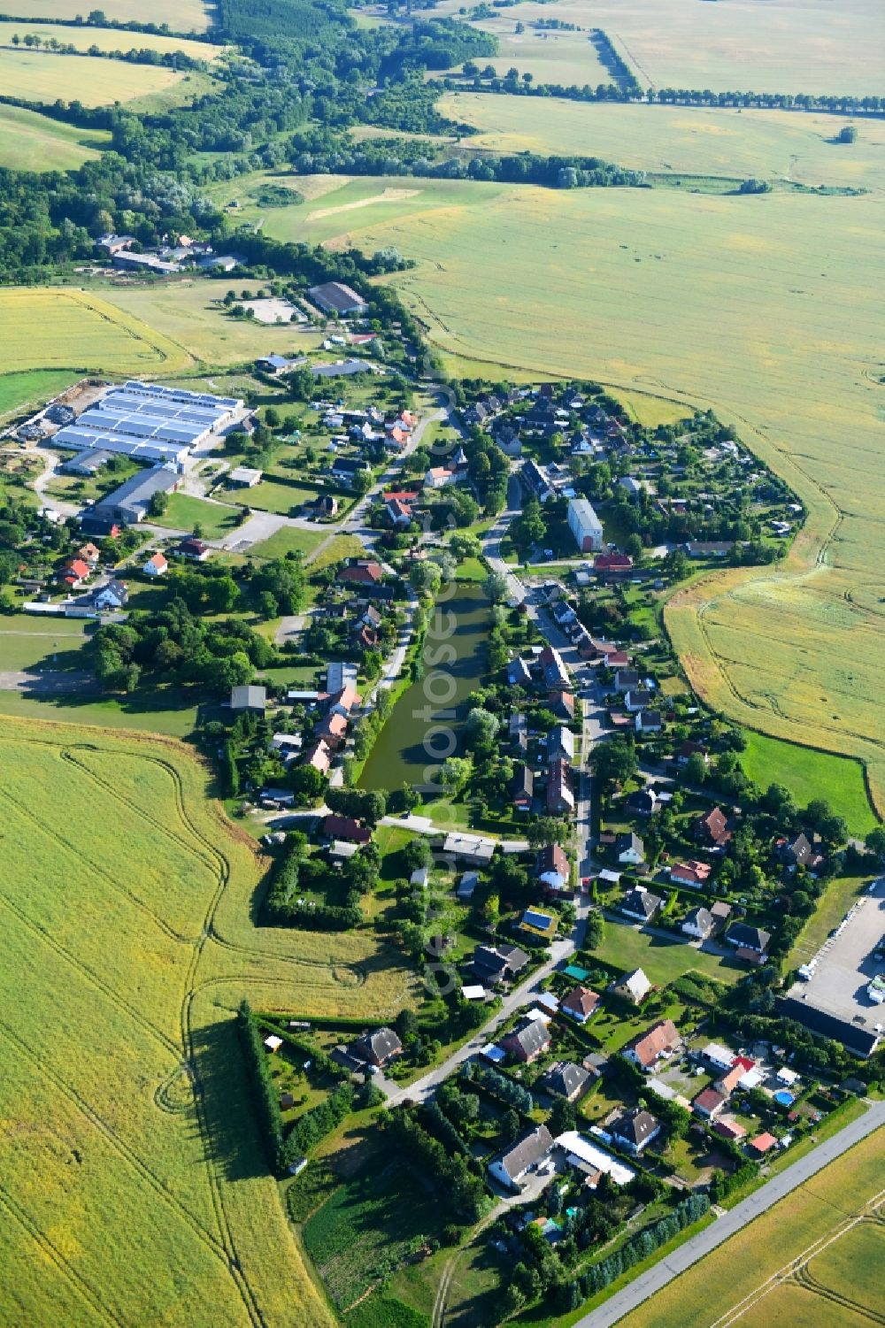 Aerial image Zirzow - Village - view on the edge of agricultural fields and farmland in Zirzow in the state Mecklenburg - Western Pomerania, Germany