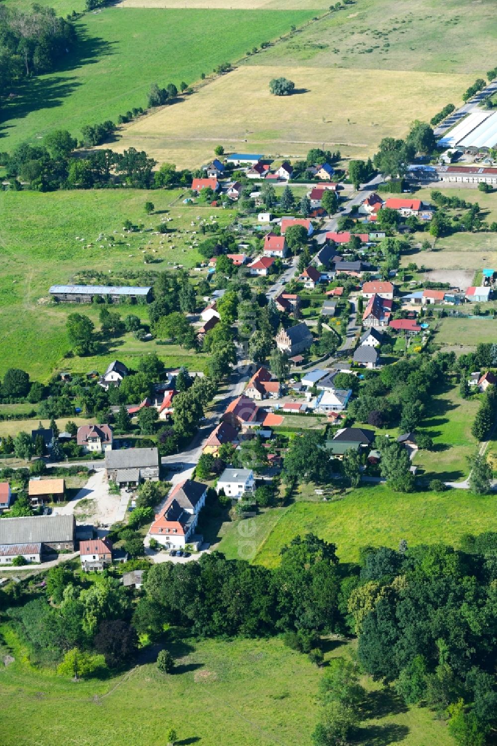 Aerial image Zützen - Village - view on the edge of agricultural fields and farmland in Zuetzen in the state Brandenburg, Germany