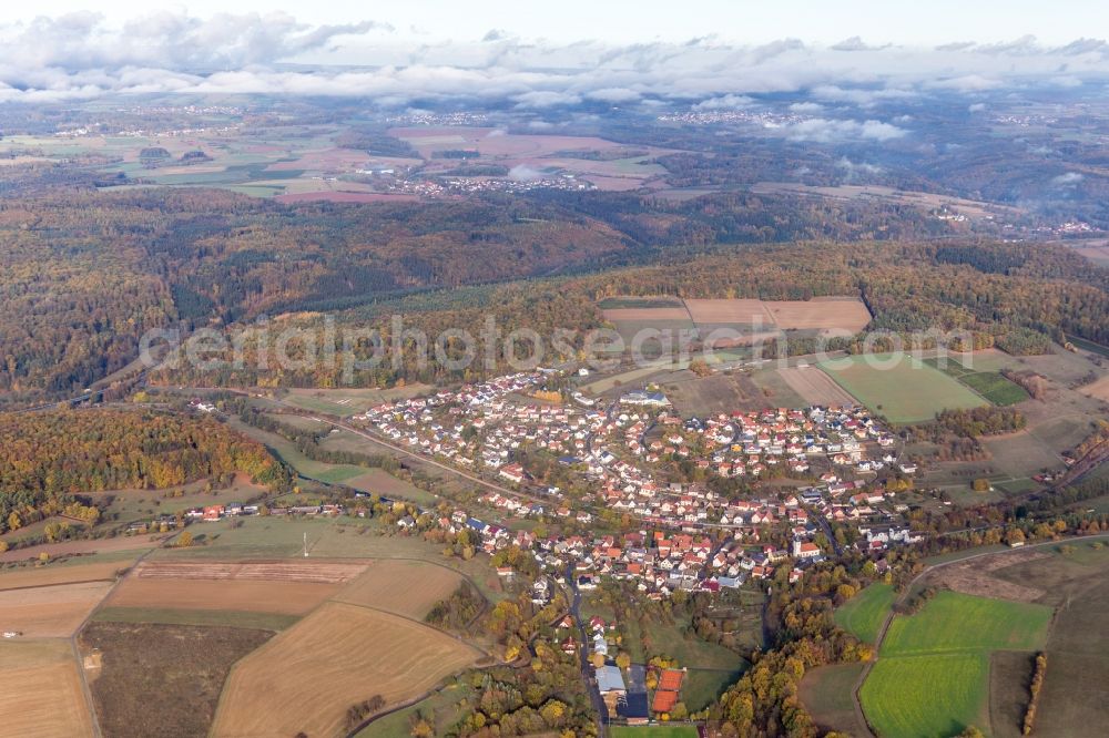 Auerbach bei Mosbach from the bird's eye view: Agricultural land and field borders surround the settlement area of the village in Auerbach bei Mosbach in the state Baden-Wurttemberg, Germany