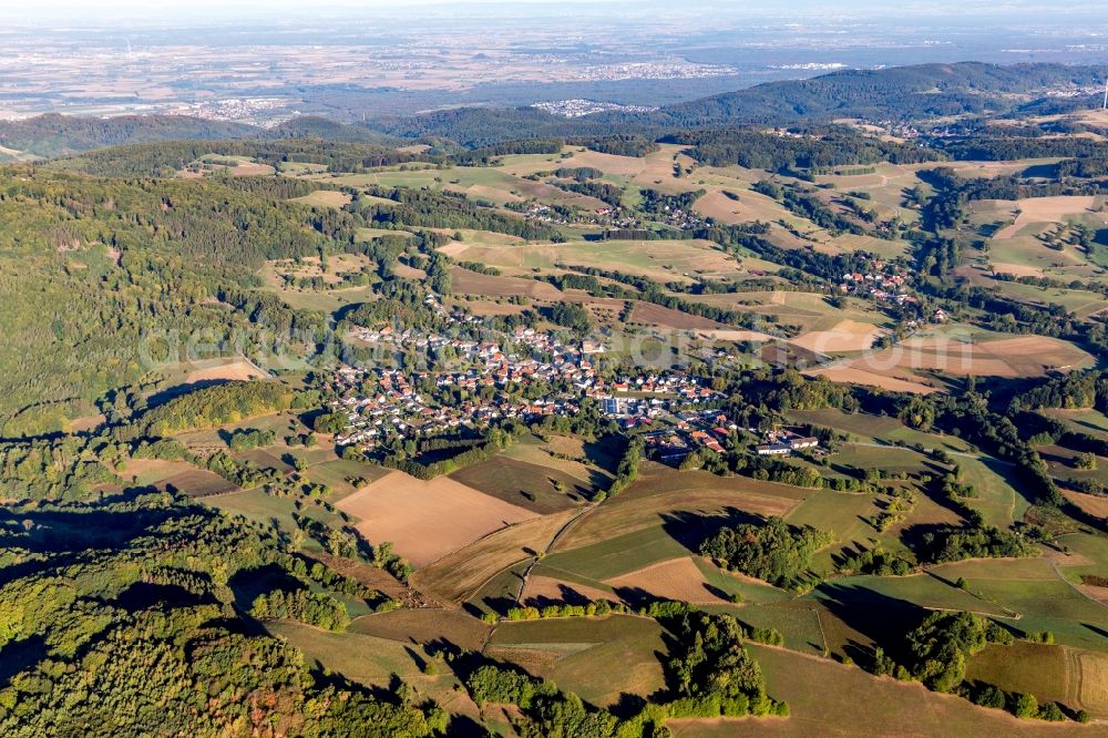 Beedenkirchen from above - Agricultural land and field borders surround the settlement area of the village in Beedenkirchen in the state Hesse, Germany