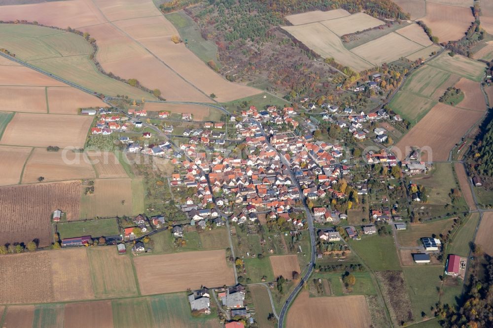 Aerial image Böttigheim - Agricultural land and field borders surround the settlement area of the village in Boettigheim in the state Bavaria, Germany