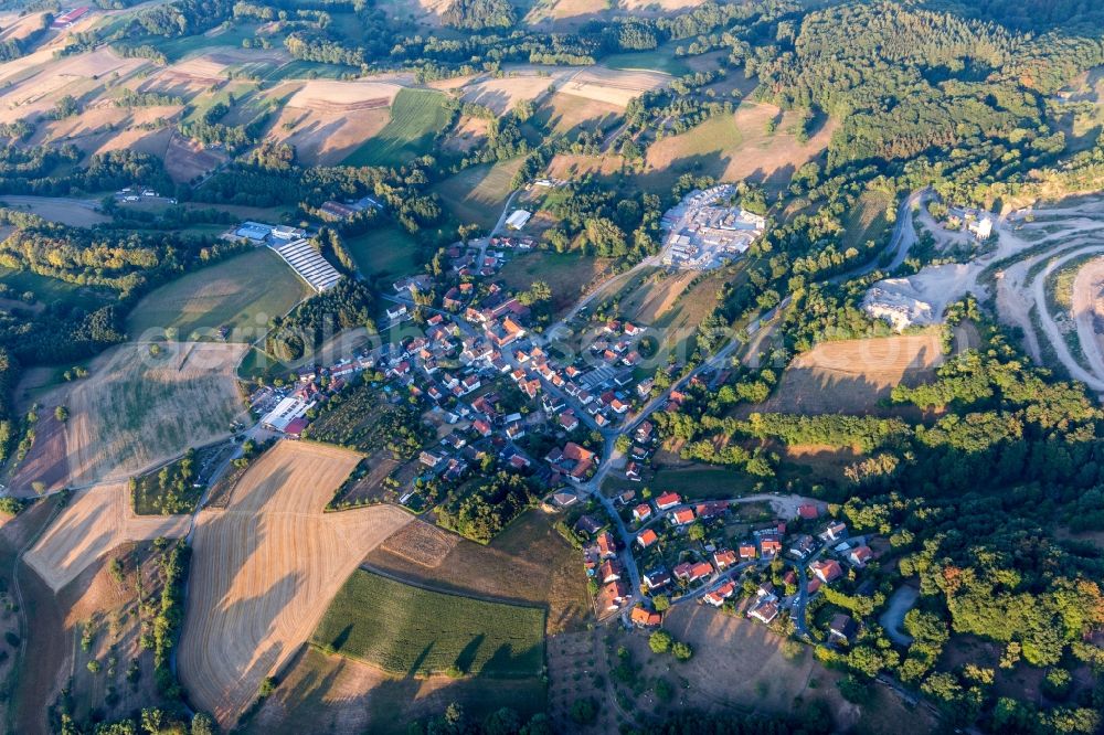 Aerial photograph Erlenbach - Agricultural land and field borders surround the settlement area of the village in Erlenbach in the state Hesse, Germany