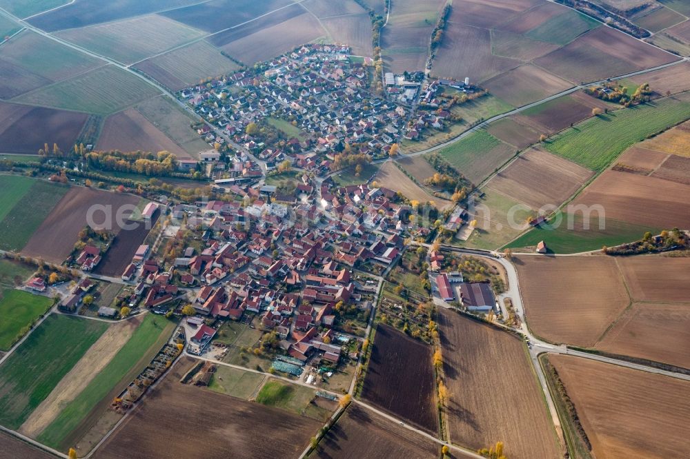 Frankenwinheim from the bird's eye view: Agricultural land and field borders surround the settlement area of the village in Frankenwinheim in the state Bavaria, Germany