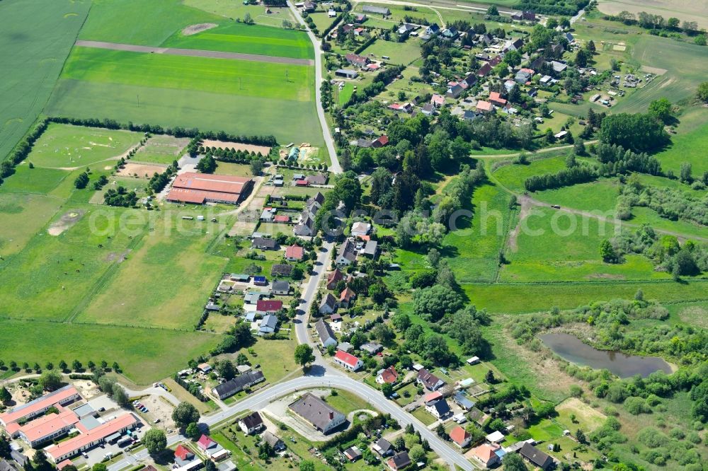 Aerial photograph Friedrichsruhe - Agricultural land and field borders surround the settlement area of the village in Friedrichsruhe in the state Mecklenburg - Western Pomerania, Germany