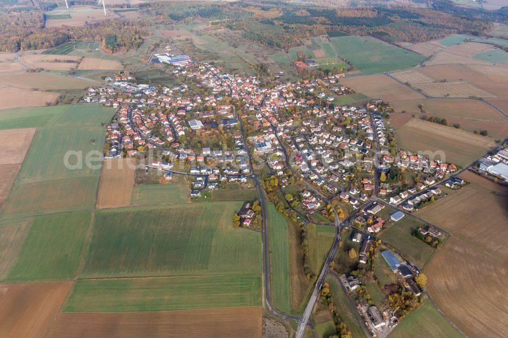 Aerial image Großeicholzheim - Agricultural land and field borders surround the settlement area of the village in Grosseicholzheim in the state Baden-Wurttemberg, Germany