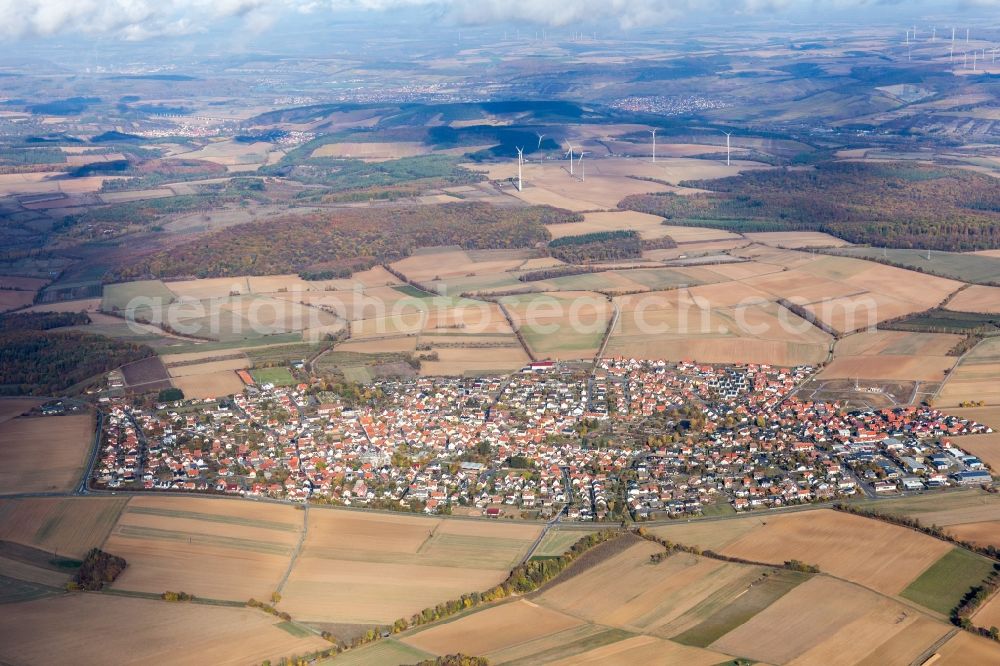 Aerial image Hettstadt - Agricultural land and field borders surround the settlement area of the village in Hettstadt in the state Bavaria, Germany