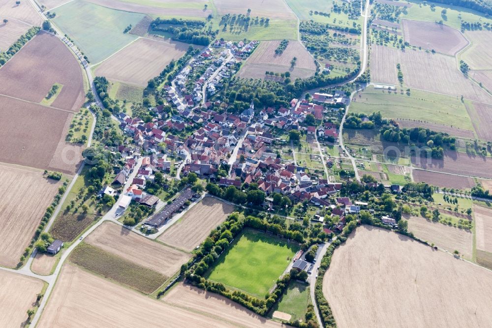 Aerial photograph Hirschlanden - Agricultural land and field borders surround the settlement area of the village in Hirschlanden in the state Baden-Wurttemberg, Germany