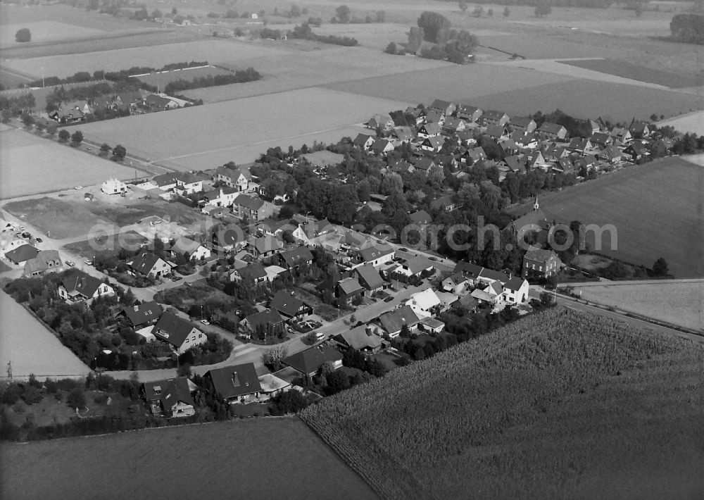 Labbeck from the bird's eye view: Agricultural land and field borders surround the settlement area of the village in Labbeck in the state North Rhine-Westphalia, Germany