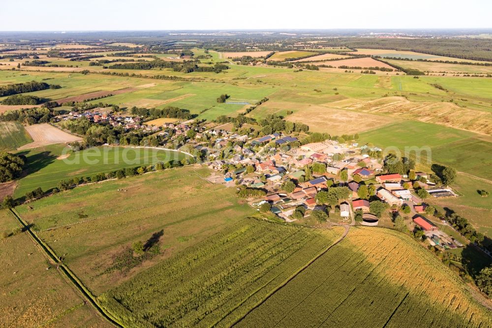 Aerial photograph Lanze - Agricultural land and field borders surround the settlement area of the village in Lanze in the state Schleswig-Holstein, Germany