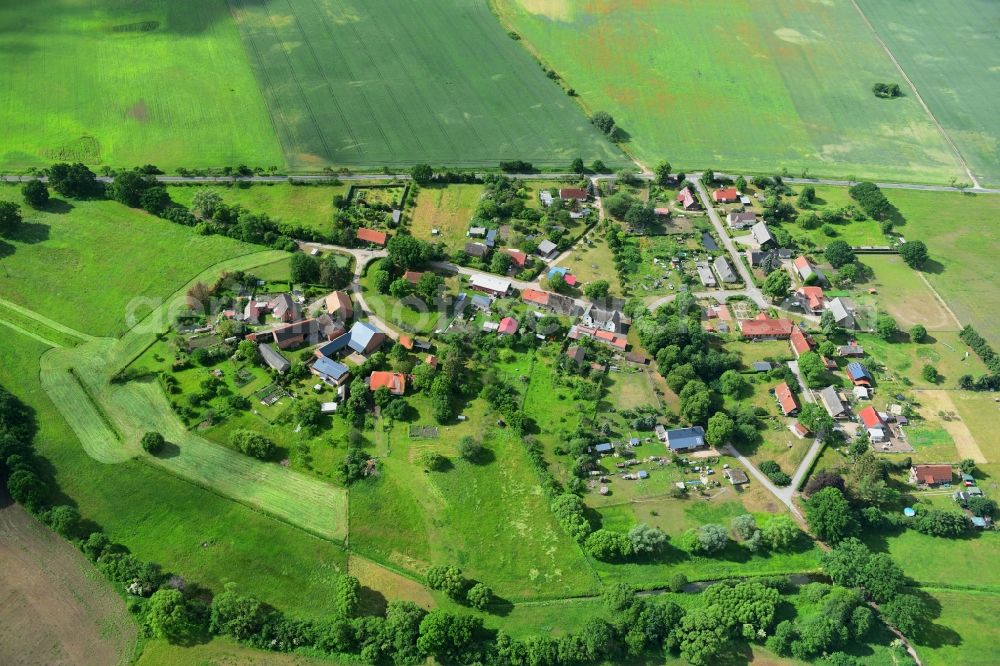 Meierstorf from above - Agricultural land and field borders surround the settlement area of the village in Meierstorf in the state Mecklenburg - Western Pomerania, Germany