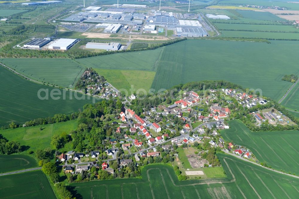 Merkwitz from the bird's eye view: Agricultural land and field borders surround the settlement area of the village in Merkwitz in the state Saxony, Germany