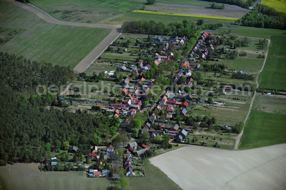 Aerial photograph Philippsthal - Agricultural land and field borders surround the settlement area of the village in Philippsthal in the state Brandenburg, Germany