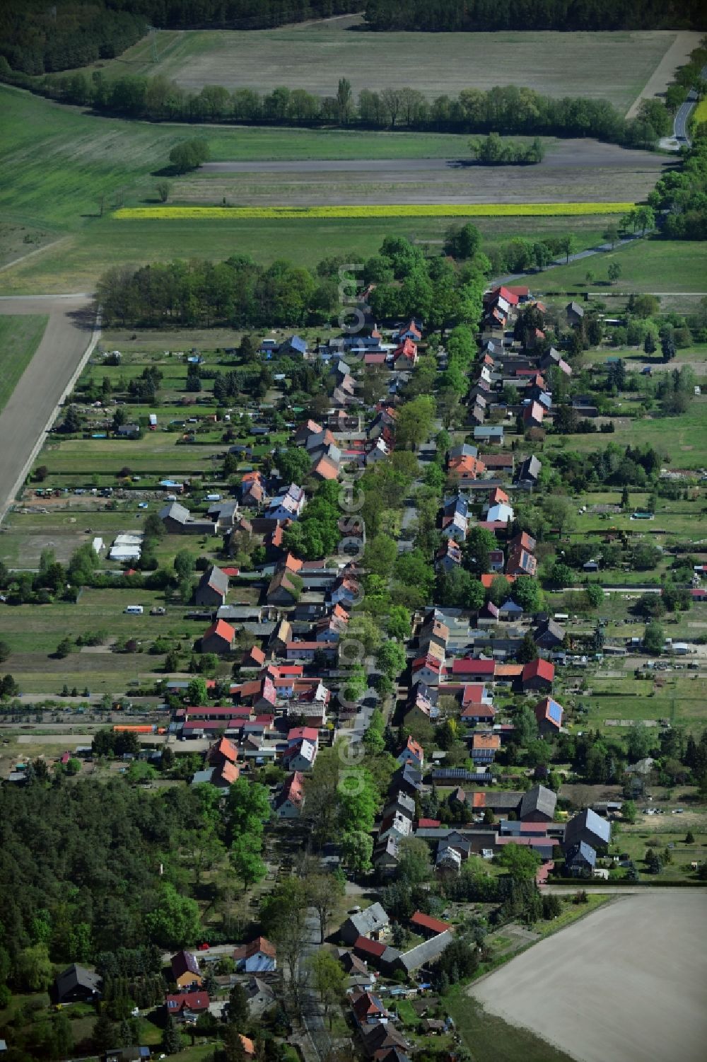 Aerial image Philippsthal - Agricultural land and field borders surround the settlement area of the village in Philippsthal in the state Brandenburg, Germany