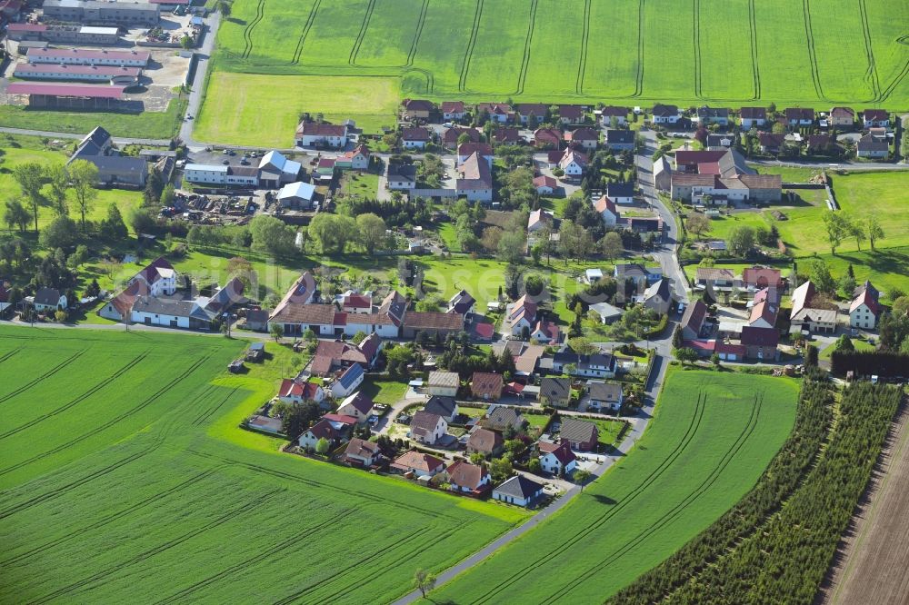 Aerial image Welxande - Agricultural land and field borders surround the settlement area of the village in Welxande in the state Saxony, Germany