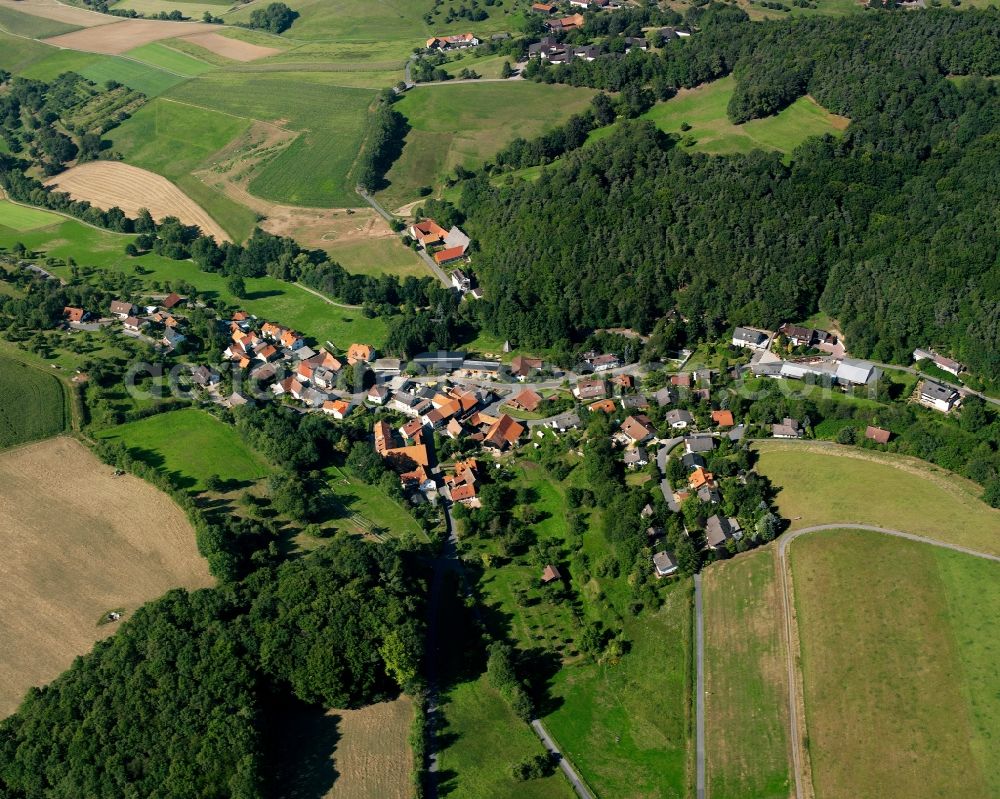 Affhöllerbach from the bird's eye view: Village - view on the edge of forested areas in Affhöllerbach in the state Hesse, Germany