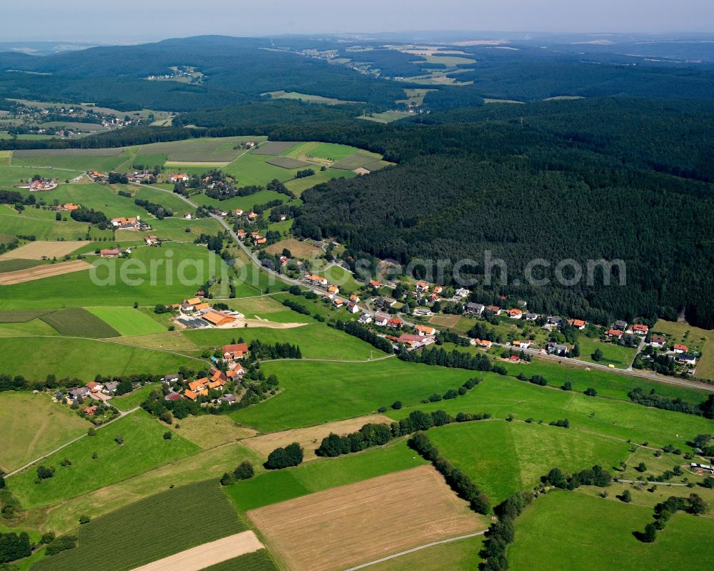 Airlenbach from the bird's eye view: Village - view on the edge of forested areas in Airlenbach in the state Hesse, Germany