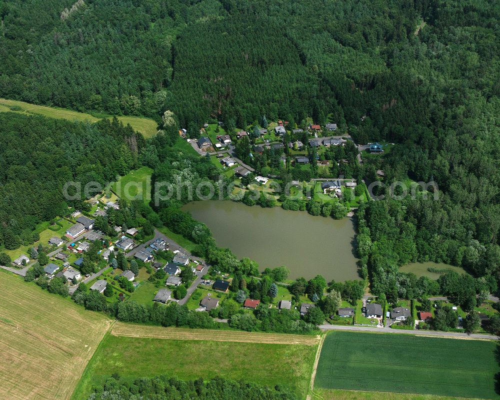 Atzenhain from the bird's eye view: Village - view on the edge of forested areas in Atzenhain in the state Hesse, Germany