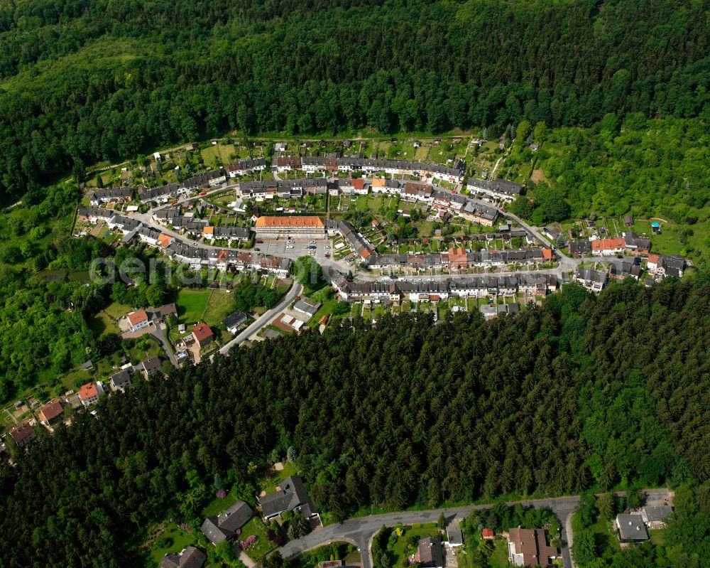 Bad from the bird's eye view: Village - view on the edge of forested areas in Bad in the state Lower Saxony, Germany