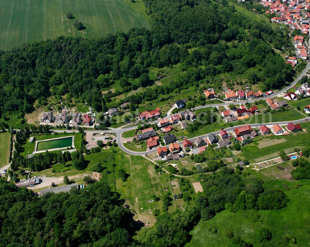 Brehme from the bird's eye view: Village - view on the edge of forested areas on street Wildunger Strasse in Brehme in the state Thuringia, Germany