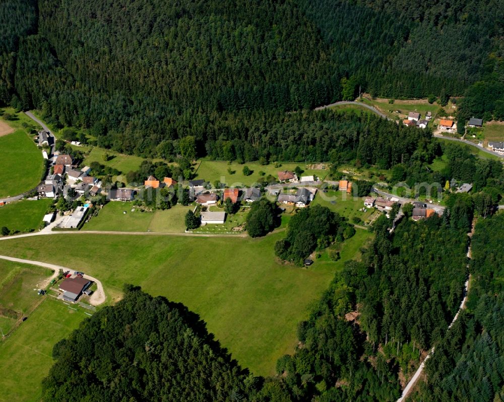 Bullau from the bird's eye view: Village - view on the edge of forested areas in Bullau in the state Hesse, Germany