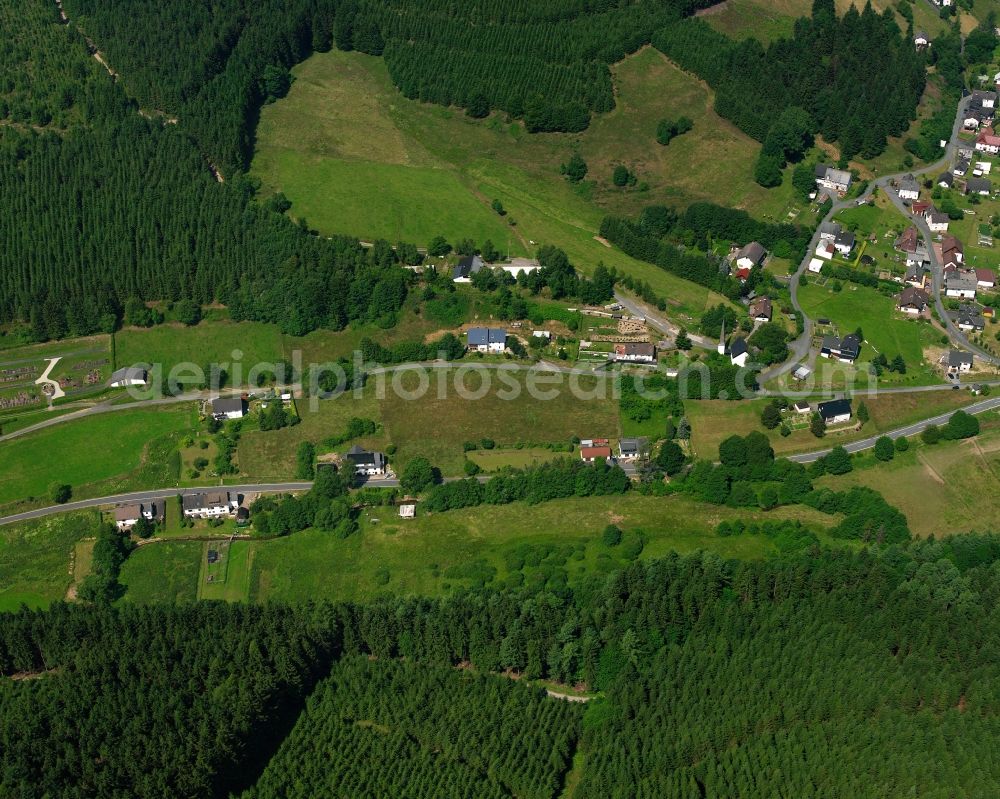 Feudingen from the bird's eye view: Village - view on the edge of forested areas in Feudingen in the state North Rhine-Westphalia, Germany