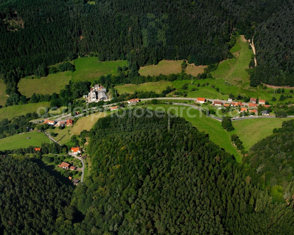 Finkenbach from the bird's eye view: Village - view on the edge of forested areas in Finkenbach in the state Hesse, Germany