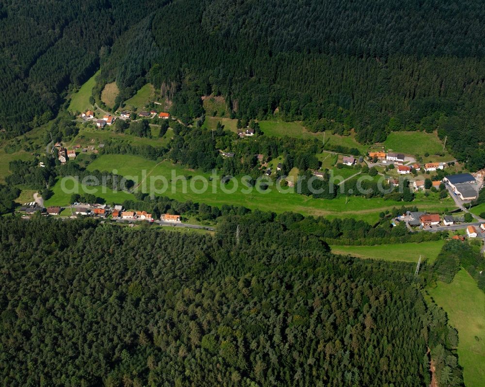 Finkenbach from the bird's eye view: Village - view on the edge of forested areas in Finkenbach in the state Hesse, Germany