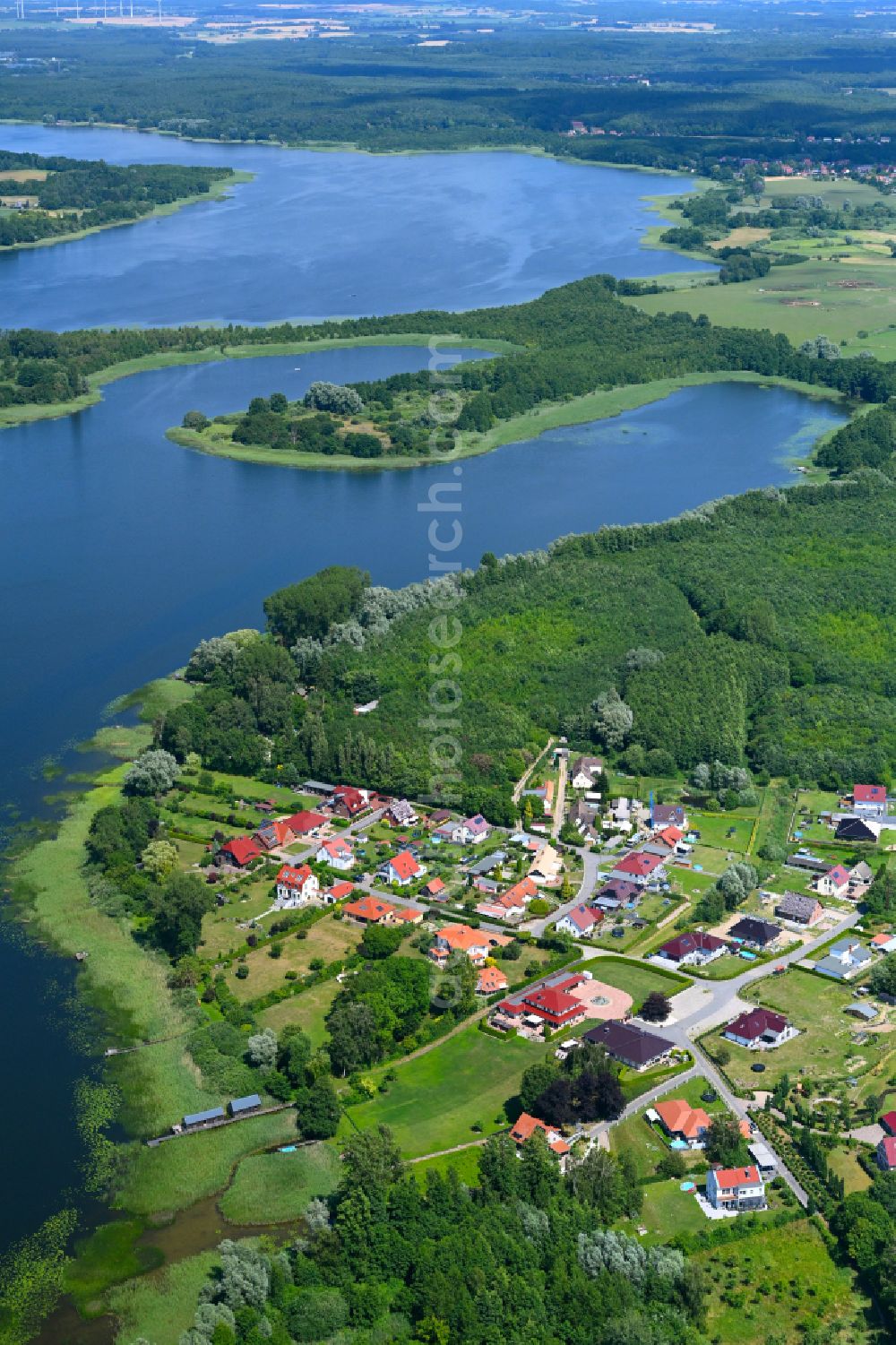 Gutow from the bird's eye view: Village - view on the edge of forested areas in Gutow in the state Mecklenburg - Western Pomerania, Germany