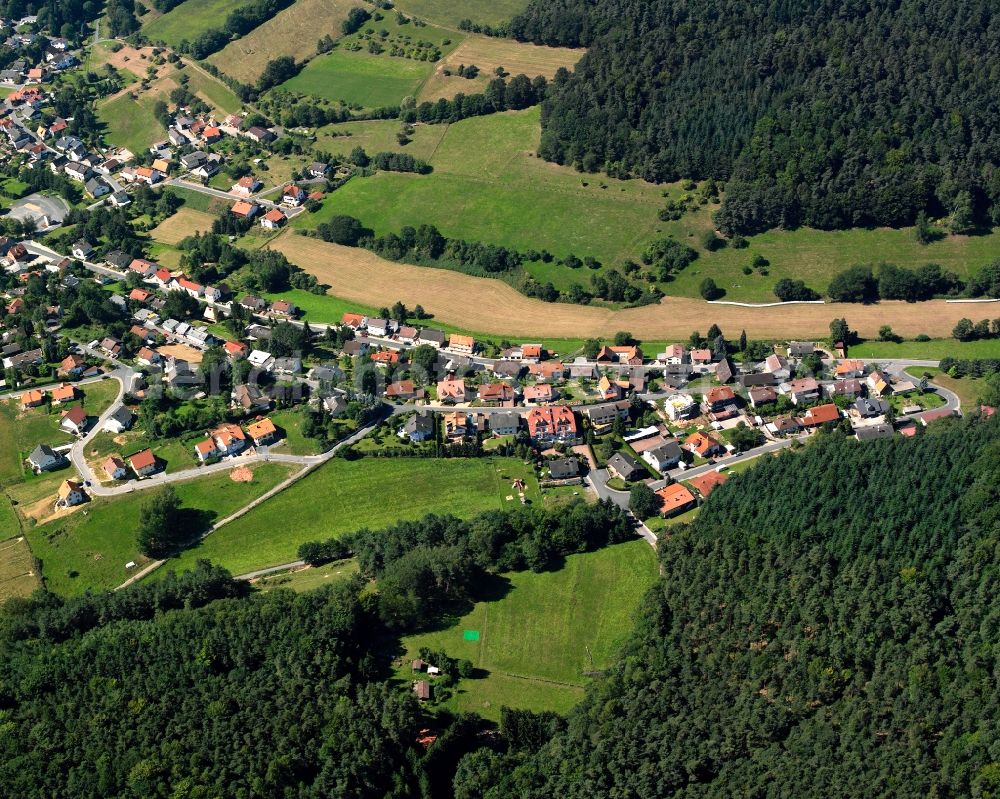 Haingrund from the bird's eye view: Village - view on the edge of forested areas in Haingrund in the state Hesse, Germany