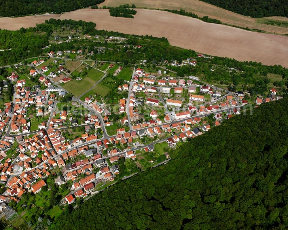 Heyerode from the bird's eye view: Village - view on the edge of forested areas in Heyerode in the state Thuringia, Germany