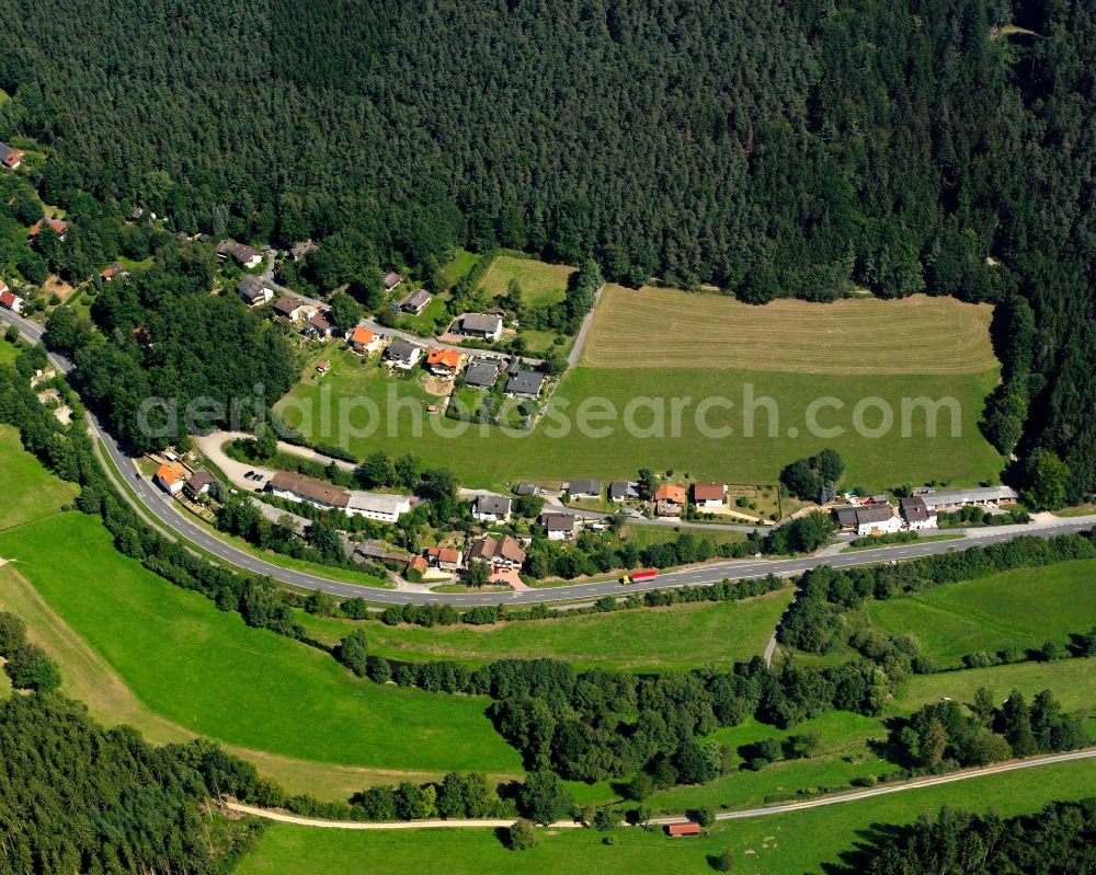 Aerial image Hüttenthal - Village - view on the edge of forested areas in Hüttenthal in the state Hesse, Germany