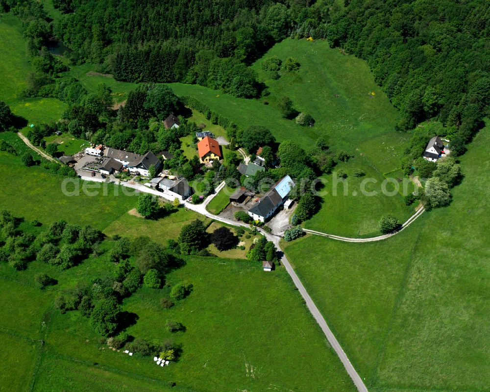 Kierspe from the bird's eye view: Village - view on the edge of forested areas in Kierspe in the state North Rhine-Westphalia, Germany