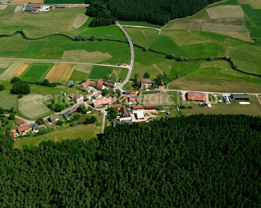 Aerial photograph Kirschendorf - Village - view on the edge of forested areas in Kirschendorf in the state Bavaria, Germany