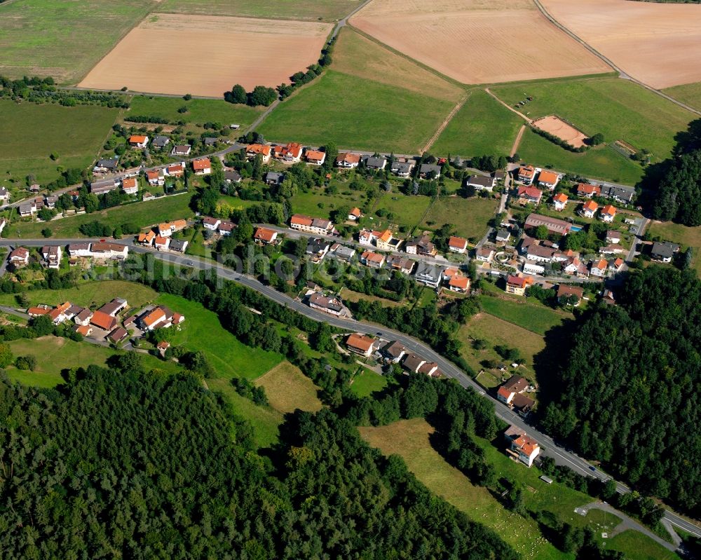 Langen-Brombach from the bird's eye view: Village - view on the edge of forested areas in Langen-Brombach in the state Hesse, Germany