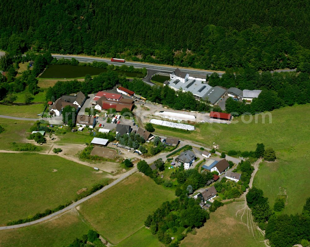 Mühlhofe from the bird's eye view: Village - view on the edge of forested areas in Mühlhofe in the state North Rhine-Westphalia, Germany