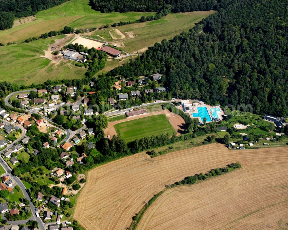 Michelstadt from the bird's eye view: Village - view on the edge of forested areas in Michelstadt in the state Hesse, Germany